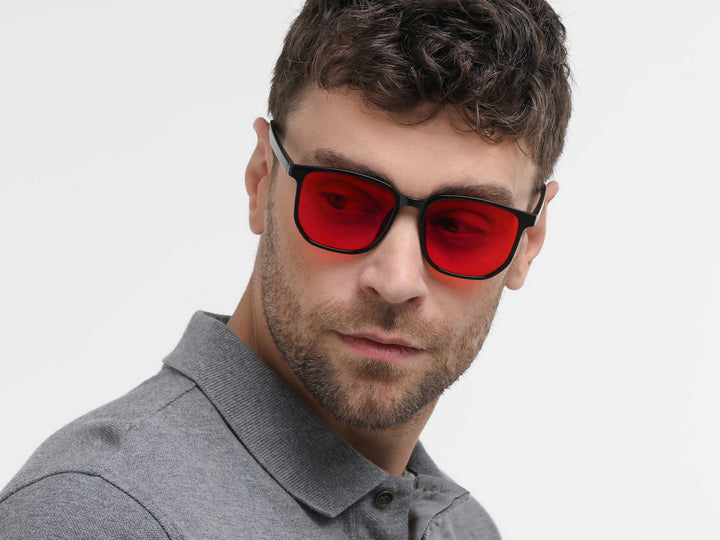Model wearing Evelenne Nocturne dark blue light glasses